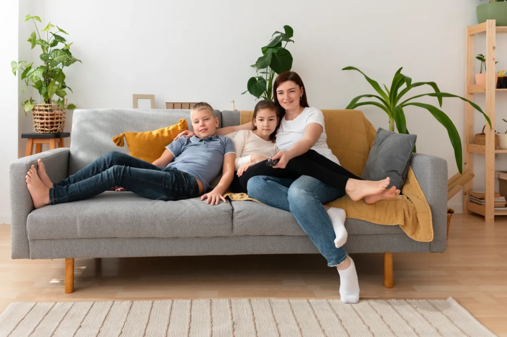 mom-watching-television-with-her-children